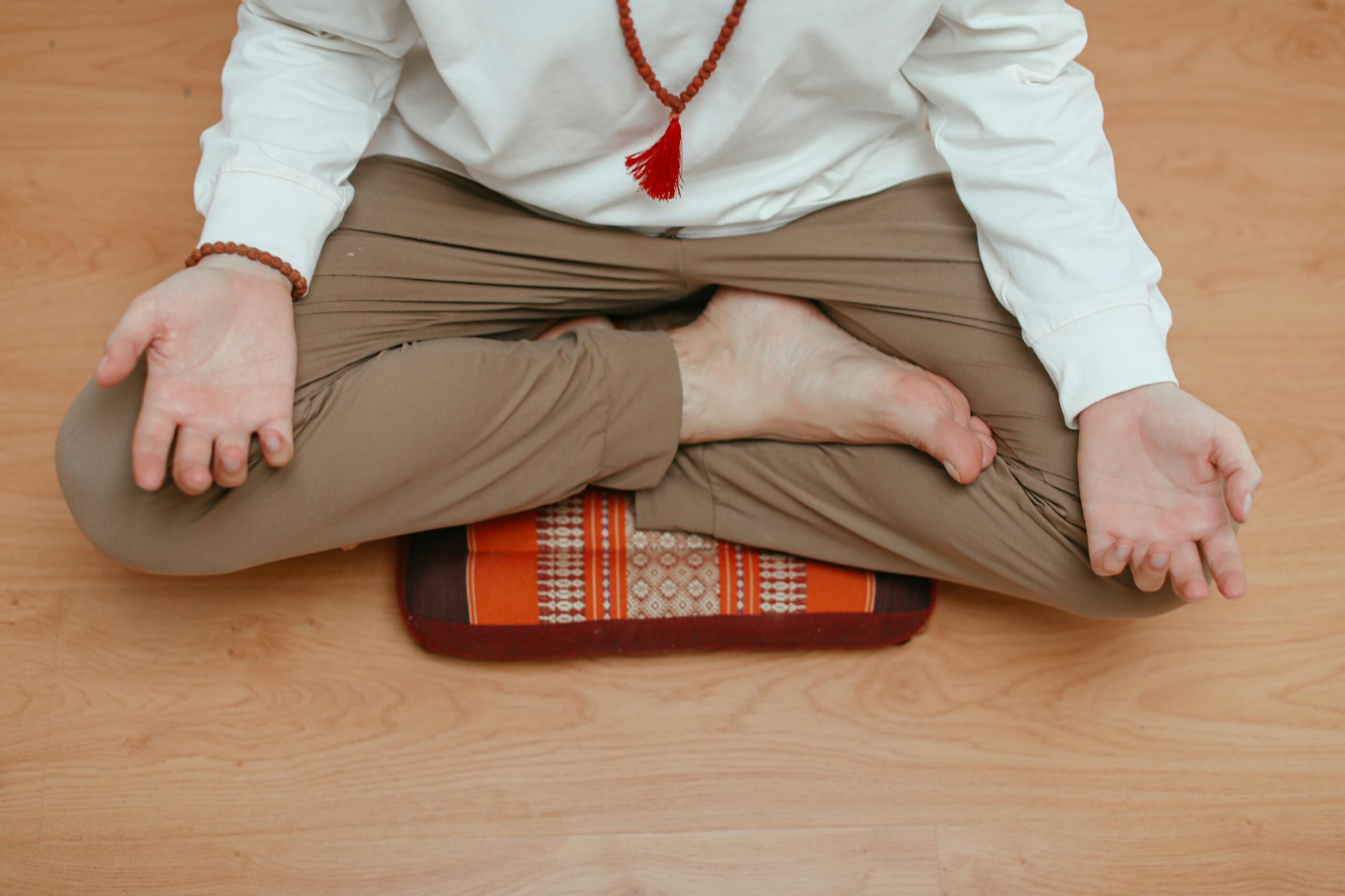 man sat on a meditation cushion