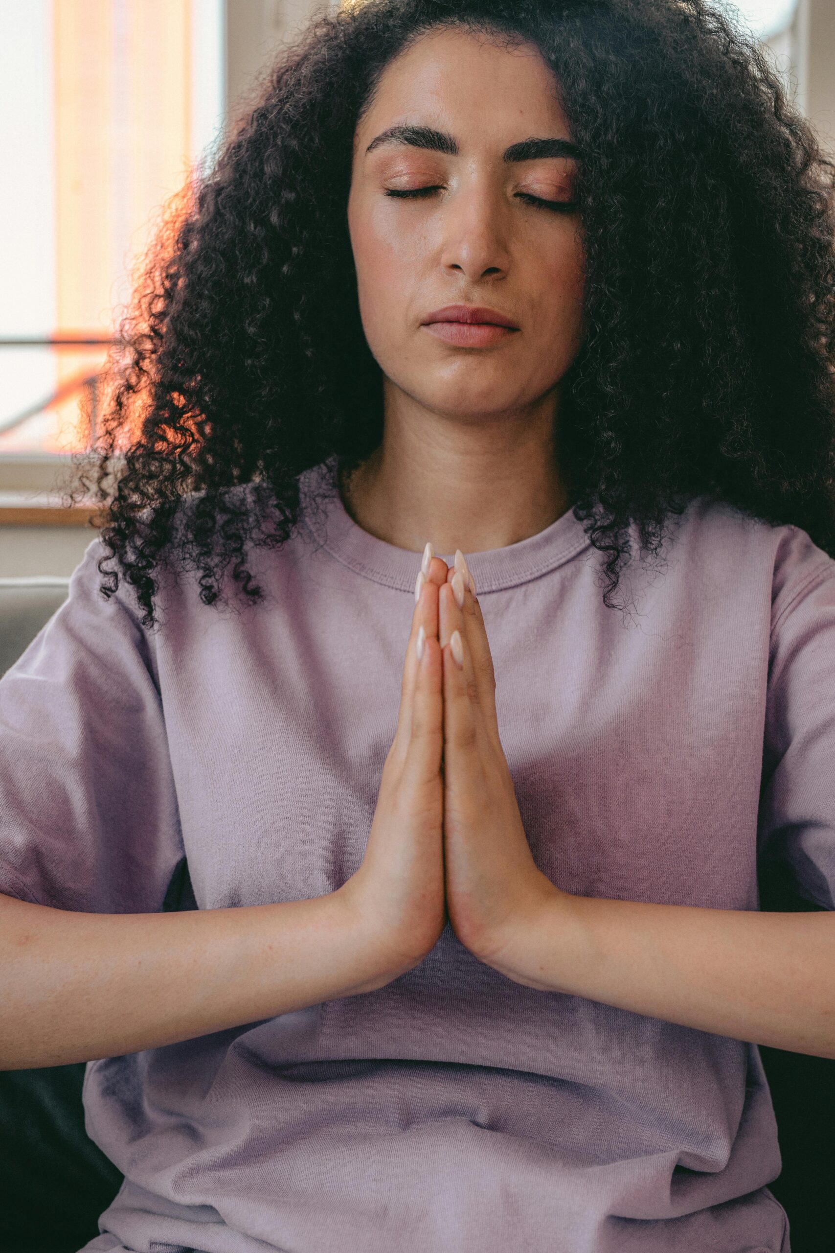 lady meditating in her home